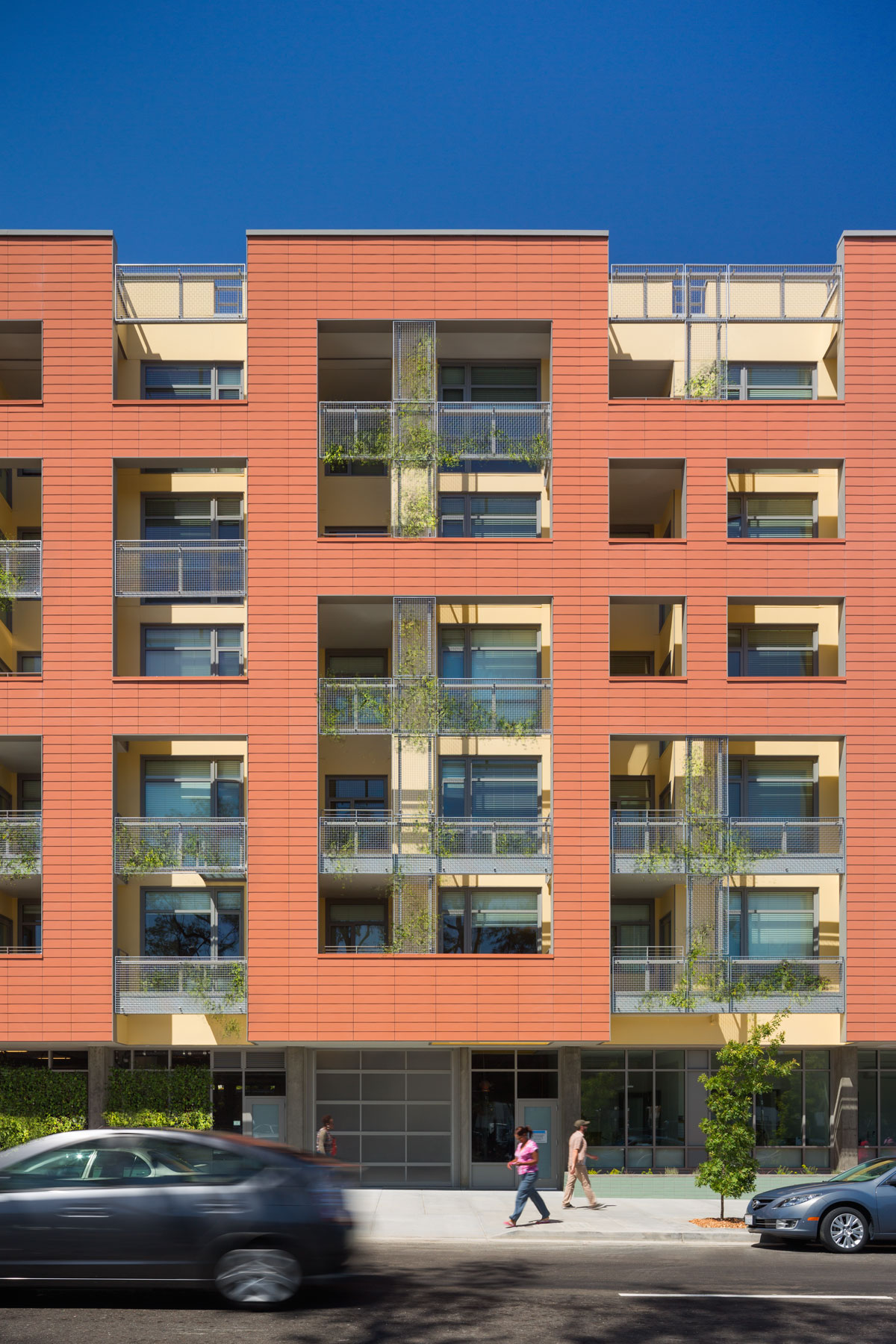 Merritt Crossing is a Green Point rated and LEED Platinum certified affordable housing building for seniors, a model of sustainable design in an urban area of Oakland in the Bay Area.
