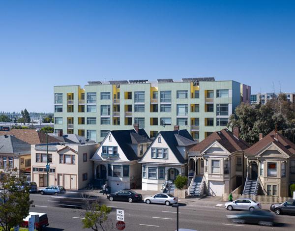 Merritt Crossing is a Green Point rated and LEED Platinum certified affordable housing building for seniors, a model of sustainable design in an urban area of Oakland in the Bay Area.